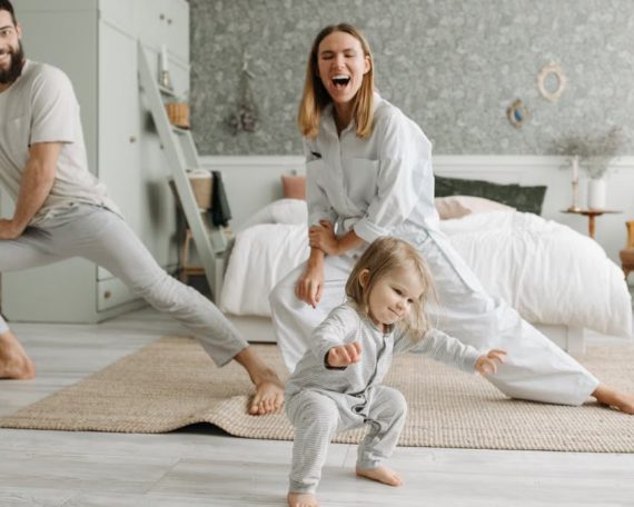 A joyful family engaging in morning stretches together, fostering a fun and healthy routine.